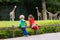 Kids watching giraffe at the zoo