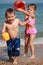 Kids watering on the beach 2