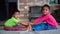 Kids yoga. Little Indian boy and girl doing yoga exercise and watching instructions on TV.. Worldwide yoga day concept