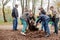 Kiev, Ukraine 16.04.2016 a group of people teenagers doing spring cleaning in the park. teens at community work outdoors