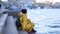 Kiev Ukraine 22-12-2018 Two young girls in Yellow Jackets sit on the pier