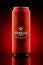 Kiev, Ukraine, 27.04.2020: Metal can beer Estrella Damm, Barcelona 1876. Red and beautiful reflections, highlights, on a red