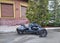 KIEV, UKRAINE - APRIL 02, 2021: Black three-wheeled motorcycle parked on the street.