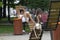 Kiev, Ukraine - August 18, 2018: Young woman reading a book on a bench