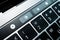 Kiev, Ukraine - August 9,2022: Screen backlight mode change button on touch bar apple macbook pro close up. True Tone, night and