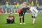 KIEV, UKRAINE - December 12, 2018: Frustrated soccer players sit on the lawn during the UEFA Champions League match between