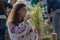 Kiev, Ukraine - July 06, 2017: Girl wreathes a wreath of herbs and flowers at the festival