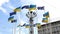 Kiev, Ukraine, July 2021: - European square in Kiev, flag poles with flag of Europe union and Ukraine fluttering against