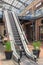 Kiev, Ukraine - July 6, 2019: Escalator Elevator Stairs Lift in Outlet Village called Manufaktura Shoping Center Looks Like