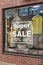 Kiev, Ukraine - July 6, 2019: Signage of Super Sale in the Shop Window in Outlet Village called Manufaktura Shoping Center Looks