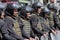 Kiev, Ukraine - June 12, 2016: Cordon of police wearing armor while protecting gay parade