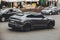 Kiev, Ukraine - June 12, 2021: Black luxury super SUV Lamborghini Urus Topcar Design in motion. Lamborghini Urus SSUV on the road