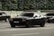 Kiev, Ukraine - June 19, 2021: Black muscle car Dodge Challenger on the road