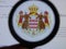 KIEV, UKRAINE - MARCH 23, 2019: Monaco coat of arms viewed through a magnifying glass