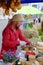KIEV, UKRAINE - MAY 19, 2018: The seller of cheese at the traditional street fair of a variety of natural organic products