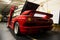 Kiev, Ukraine - May 22, 2021: Red luxury supercar Lamborghini Diablo Koenig with open door. Exclusive red supercar