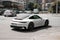 Kiev, Ukraine - May 22, 2021: White supercar Porsche 911 Carrera 4S in motion. High speed. Porsche in the city
