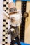 KIEV, Ukraine - September 06 ,2020: Author`s doll made in the technique of realism. Fairytale March Hare with top hat and monocle