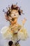 KIEV, Ukraine - September 06 ,2020: The doll looks like a real one. Spring girl with a wreath on her head. A bird sits on a girl`