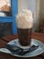KIEV, UKRAINE - September 18, 2019: Viennese coffee in a cafe with a large portion of whipped cream