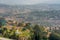 Kigali, Rwanda - September 21, 2018: A high angle view of the fountain roundabout near the city centre with rows of hills fading