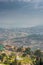 Kigali, Rwanda - September 21, 2018: A high angle view of the fountain roundabout near the city centre with rows of hills fading