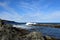 Killick Coast seascape with a wave hitting a rock in the ocean making a big splash