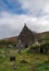 Kilmalkedar church with cloudy sky