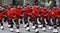 Kilted Bagpipe players marching