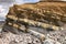 Kilve beach near East Quantoxhead in Somerset, England. The huge exposed layers of rock date back to the Jurassic era and are a