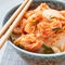 Kimchi cabbage. Korean appetizer in bowl, square format