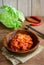 Kimchi with Chopsticks on wooden table, korean food