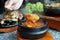 Kimchi Soup with tofu and pork belly served in clay pot, One of the most loved of all the stews in Korean cuisine.