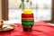 kinara kwanzaa candle holder on a table with a white cloth
