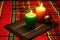 kinara with unlit candles on a kwanzaa mat