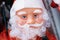 Kind friendly Santa Claus doll face with curly beard