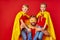 Kind responsible father with children pretend to be superhero