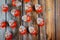 Kinder Surprise eggs on old wooden background. Word Surprise written in manufactured by Italian company Ferrero