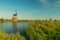 Kinderdijk canals with windmills. Sunset in Dutch village Kinder