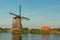 Kinderdijk canals with windmills. Sunset in Dutch village Kinder