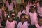 Kindergarten children in rural Haiti model their new friendship bracelets.