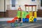 Kindergarten playground with bright toy car and funny bench. Children activities and recreation outdoors