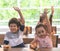 Kindergarten students hand up for pizza