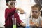 Kindergarten Students Mixing Solution in Science Experiment Laboratory Class