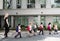 Kindergarten students walking crossing school road