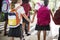 Kindergarten students walking crossing school road