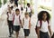 Kindergarten students walking together in school