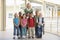 Kindergarten teacher standing with children