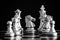 The King in battle chess game stand on chessboard with black iso