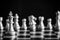 The King in battle chess game stand on chessboard with black iso